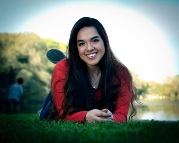 istock High School Senior Megan Posing for Graduation Photos 1135518357