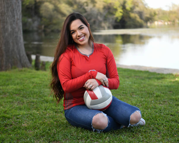 istock High School Senior Megan Posing for Graduation Photos 1135519587