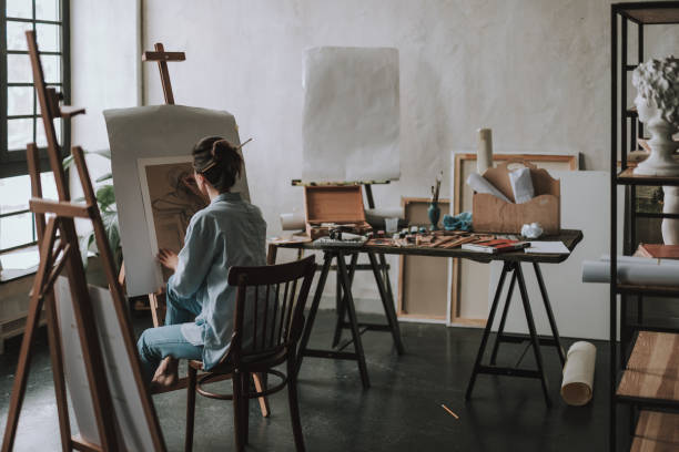 istock Rare view of talented artist drawing in art studio 1135519652