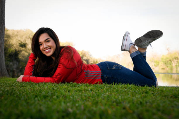 Beautiful high school senior at the park. Posing for graduation pictures class of 2019.