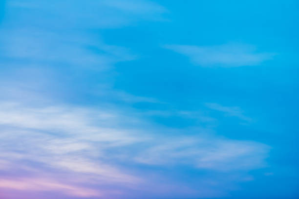istock Sunset sky with pink lilac light clouds. Colorful smooth blue white sky gradient. Natural sunrise background. Amazing heaven at morning. Slightly cloudy evening atmosphere. Wonderful weather on dawn. 1135520551