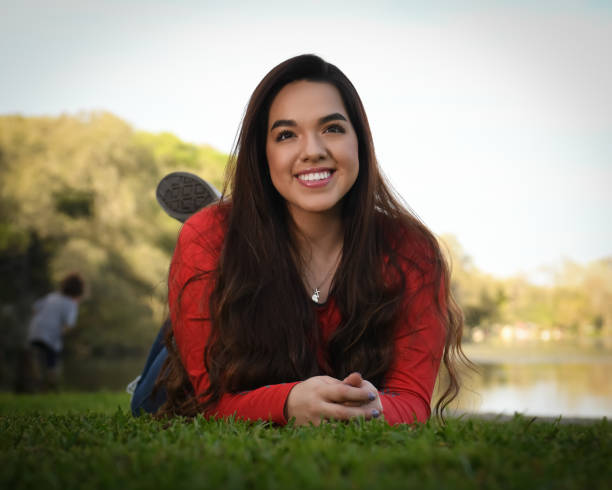 istock High School Senior Megan Posing for Graduation Photos 1135520563