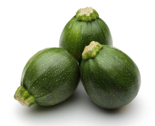 istock Green round zucchini isolated on white 1135521152