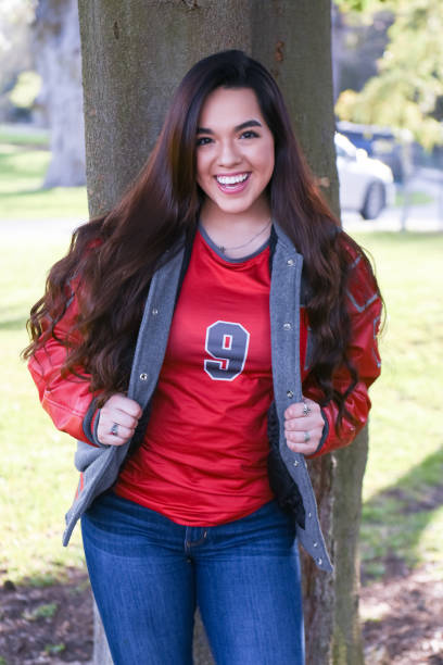 istock High School Senior Megan Posing for Graduation Photos 1135521281