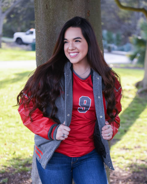 istock High School Senior Megan Posing for Graduation Photos 1135521422