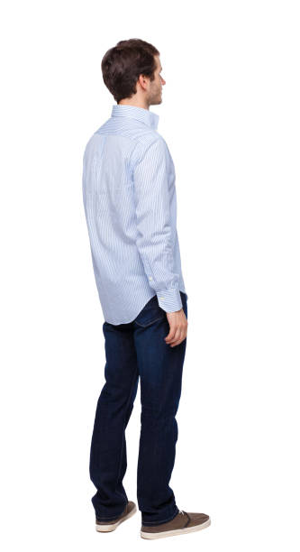 istock Back view of man in dark jeans. Standing young guy. 1135521452