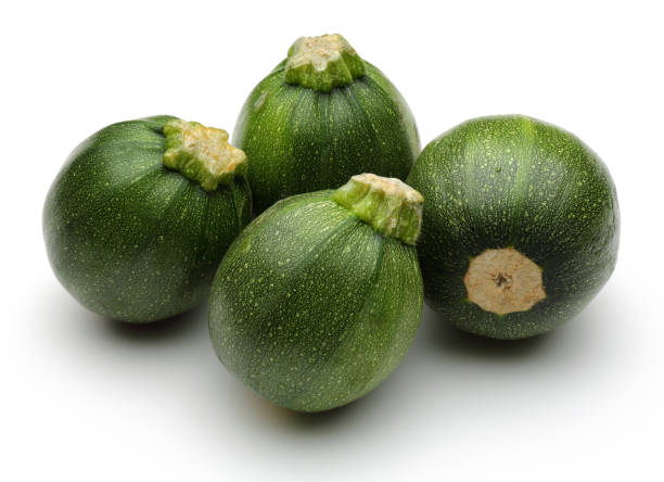istock Green round zucchini isolated on white 1135521574
