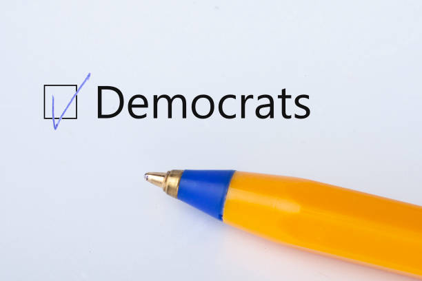 istock democrats - checkbox with a tick on white paper with yellow pen. Checklist concept. 1135521757
