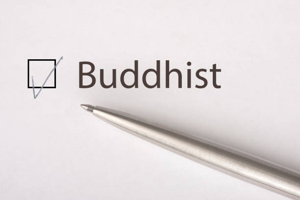 istock Buddhist - checkbox with a tick on white paper with metal pen. Checklist concept. 1135521898