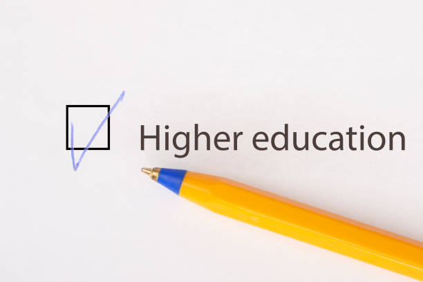 istock Higher education - checkbox with a tick on white paper with yellow pen. Checklist concept. 1135521908