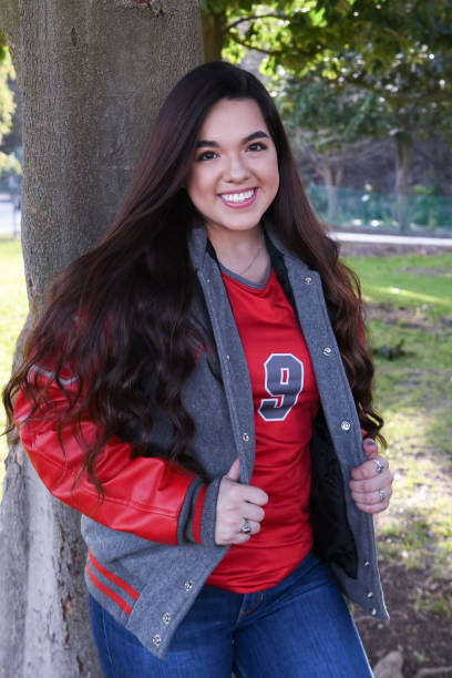istock Beautiful High School Senior posing for graduation photos 1135522055