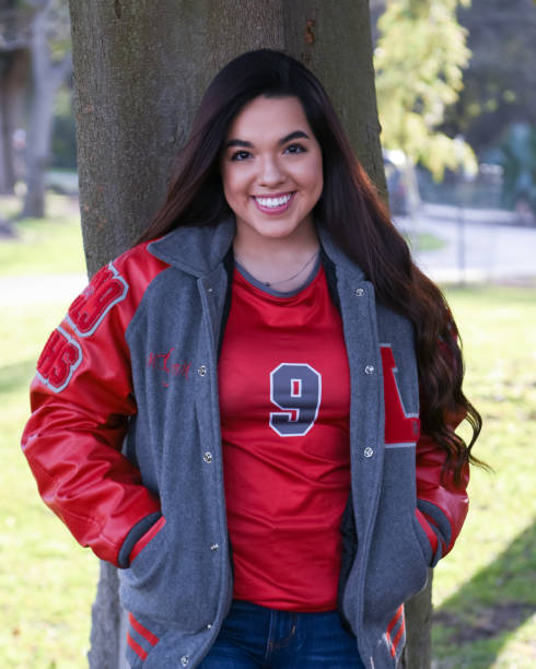 istock Beautiful High School Senior posing for graduation photos 1135522114