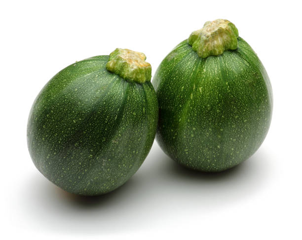 istock Green round zucchini isolated on white 1135522120