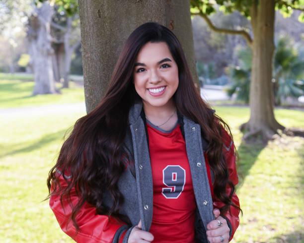 istock Beautiful High School Senior posing for graduation photos 1135522123