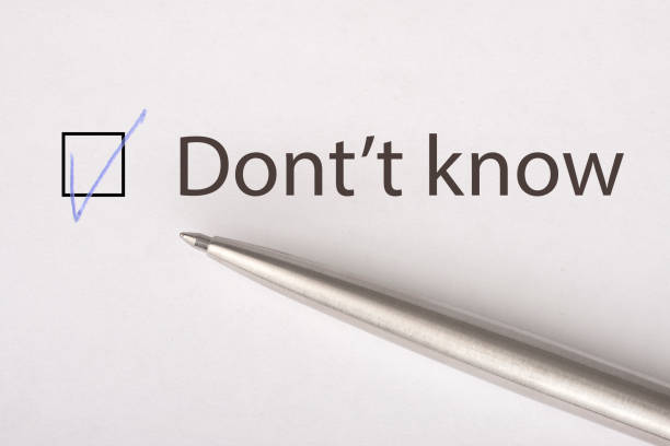 istock Don't know - checkbox with a tick on white paper with metal pen. Checklist concept. 1135522190