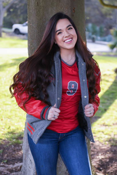 istock Beautiful High School Senior posing for graduation photos 1135522196