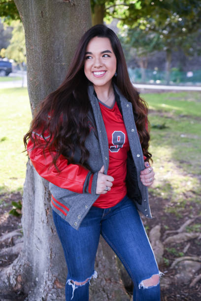 istock Beautiful High School Senior posing for graduation photos 1135522853