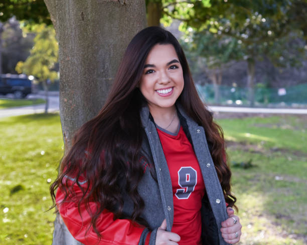 istock Beautiful High School Senior posing for graduation photos 1135522967