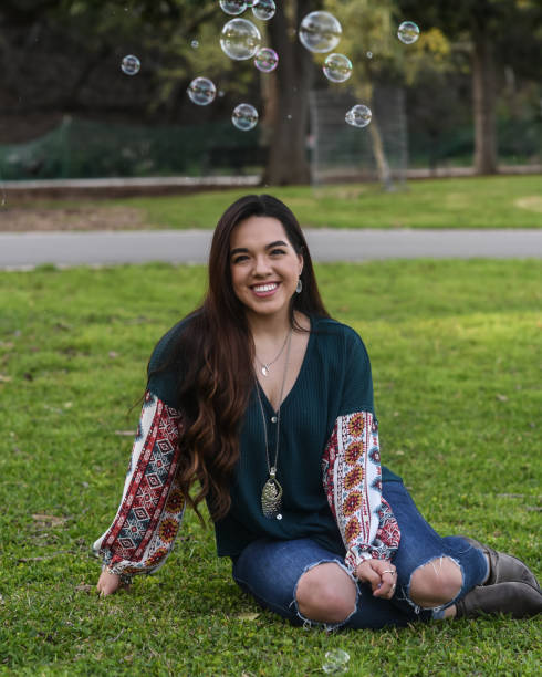 istock Beautiful High School Senior posing for graduation photos 1135523098