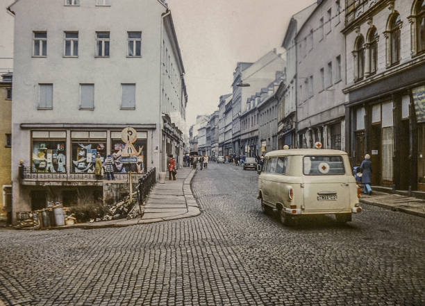 In the streets of Annaberg (GDR 1978) Annaberg-Buchholz, GDR, 1978 - On the way in the streets of Annaberg-Buchholz in the Erzgebirge. A Barkas B1000 is on the way to the hospital of Annaberg as ambulance. east germany stock pictures, royalty-free photos & images