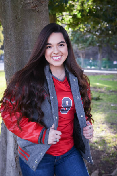 istock Beautiful High School Senior posing for graduation photos 1135523573