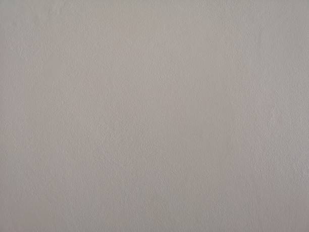 istock cement wall gray paint color rough surface texture material background wallpaper 1135523749