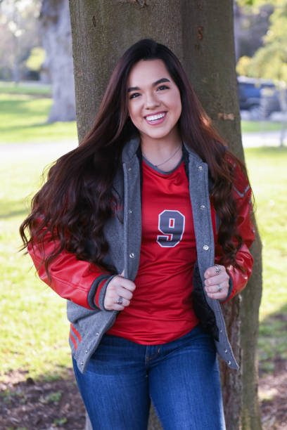 istock Beautiful High School Senior posing for graduation photos 1135523806