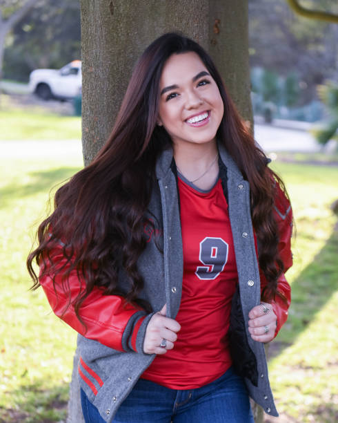 istock Beautiful High School Senior posing for graduation photos 1135523851