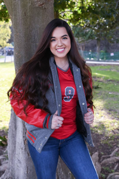 istock Beautiful High School Senior posing for graduation photos 1135523922