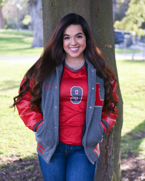 istock Beautiful High School Senior posing for graduation photos 1135525813