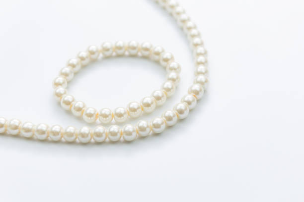 istock Pearl necklace on white background 1135527346