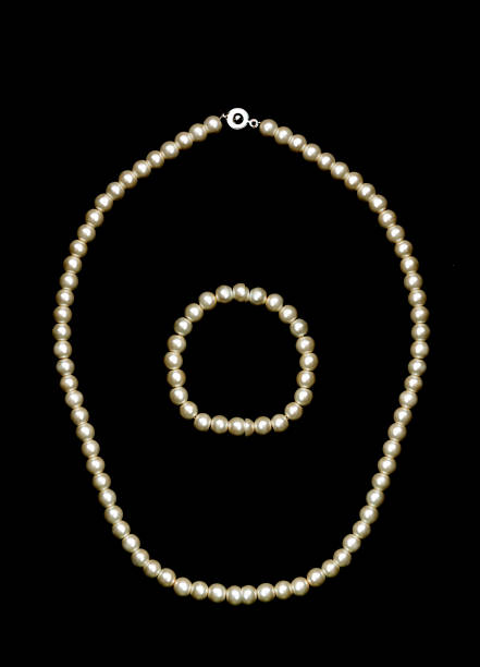istock Pearl necklace on black background 1135527383