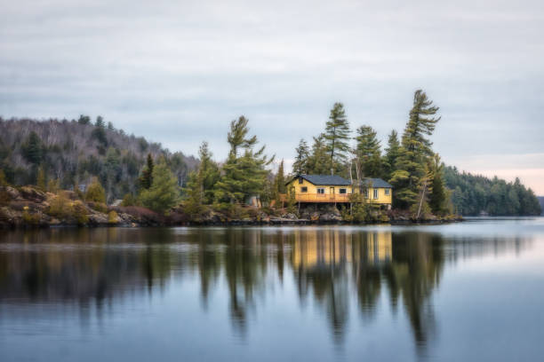 small and lovely cabin on the lake , yellow, blue