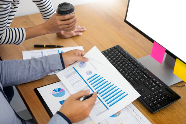istock Midsection Of Business Coworkers Discussing Over Graph In Office 1135533258