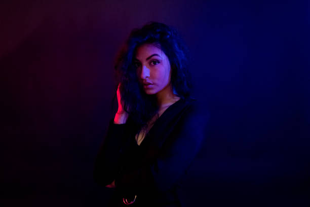 istock Attractive female in blue and red light 1135533818