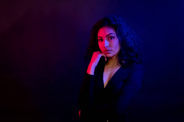 istock Attractive female in blue and red light 1135533919