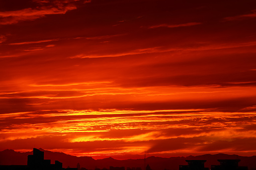 Fiery orange sunset sky. Beautiful sky background.