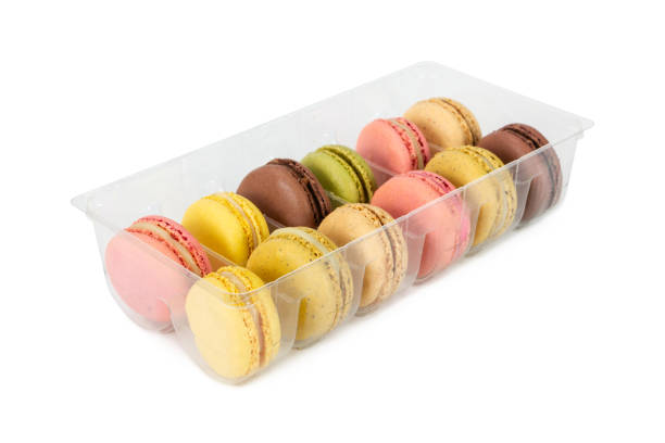 istock Colorful french macaroons in plastic box isolated on white 1135536478