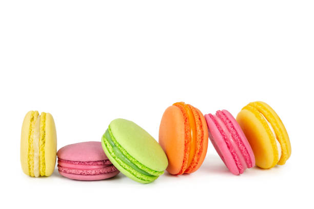 istock Colorful french macaroons in row isolated on white 1135536483