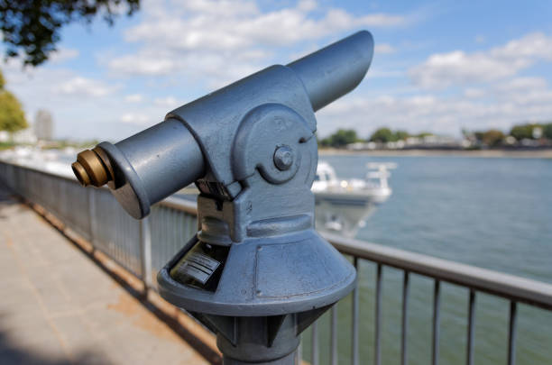 istock coin-operated telescope by river 1135538037