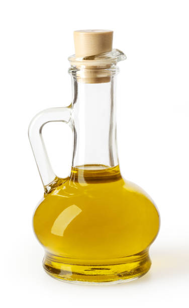 istock Olive oil in glass bottle isolated on white backgound with clipping path 1135538430