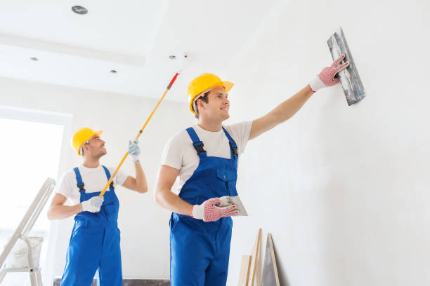 istock group of builders with tools indoors 1135539782