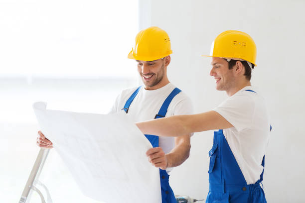 istock group of builders with blueprint 1135540023