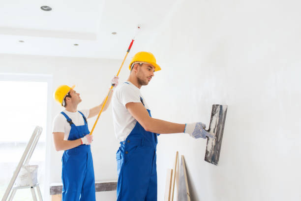 istock group of builders with tools indoors 1135540895