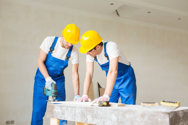 istock group of builders with tools indoors 1135540961