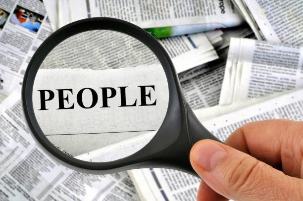 istock The press people with a magnifying glass 1135540964