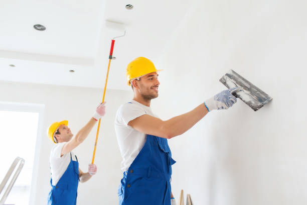istock group of builders with tools indoors 1135541000