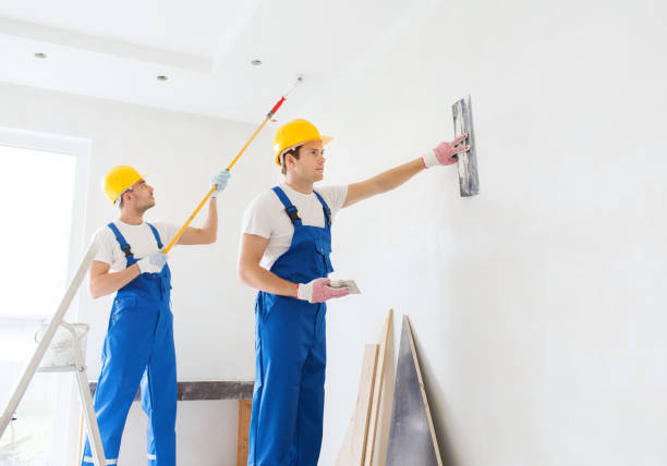 istock group of builders with tools indoors 1135541293