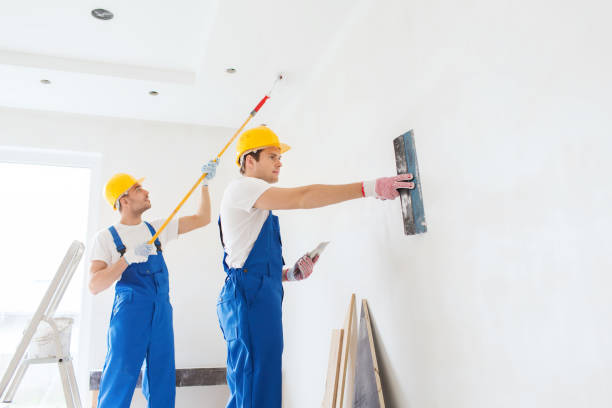 istock group of builders with tools indoors 1135541629