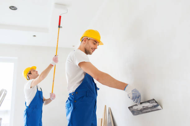 istock group of builders with tools indoors 1135541647